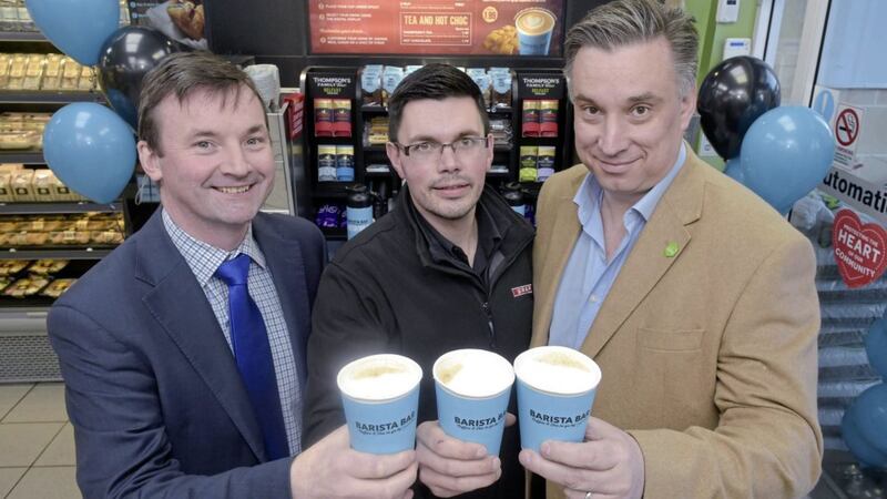 Ronan Gourley, national sales manager Ireland of UCC Cofee; David, store manager at Milltown Spar Ballymoney; and Mark Stewart-Maunder, Business development director of Henderson Foodservice celebrate the success of the the coffee brand 