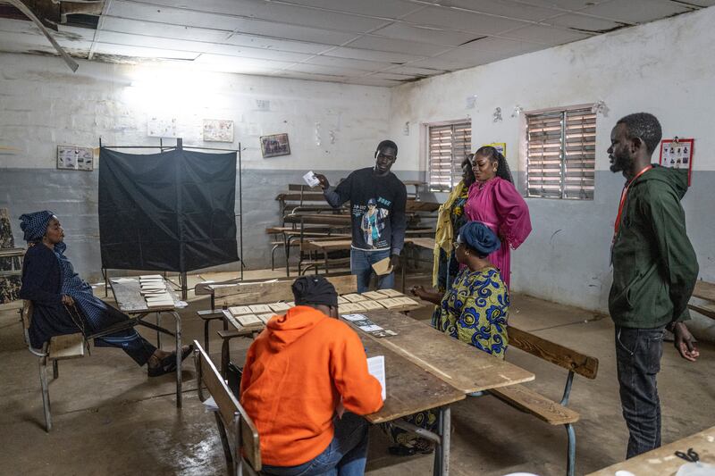 Election officials count votes in Dakar (Sylvain Cherkaoui/AP)