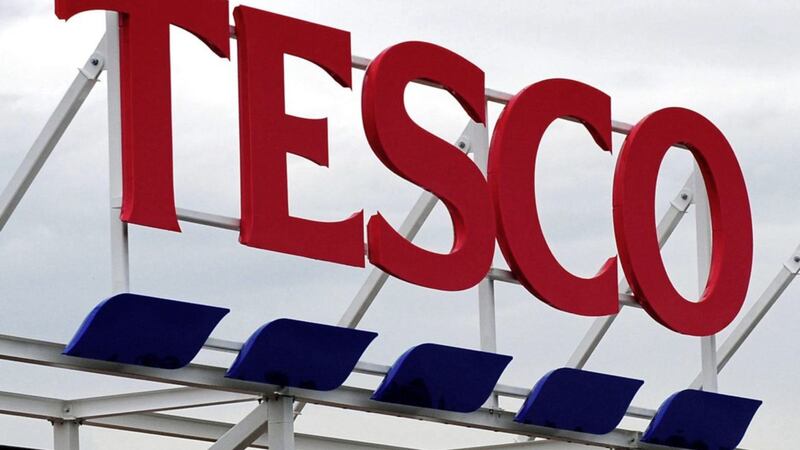 Supermarket giant Tesco has reported its first full-year increase in UK sales for seven years as its recovery under boss Dave Lewis gathers pace 