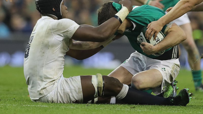 Ireland's Johnny Sexton is tackled high by England's Maro Itoje at the RBS 6 Nations match at the Aviva Stadium, Dublin.