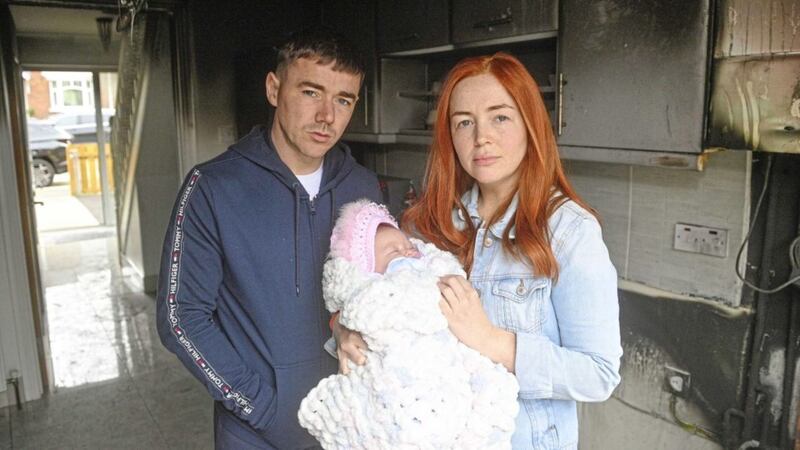 Jackie Dynes and Claire Tolan with baby Darcy at their home on Brighton Street in west Belfast. Picture by Mark Marlow 