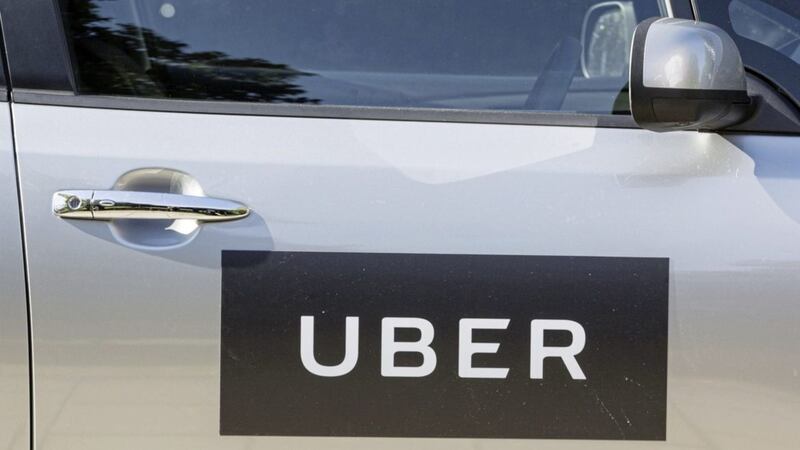Uber will give its UK drivers a minimum wage, paid holiday and an automatic pension plan from Wednesday, the firm said. Picture by Laura Dale/PA Wire. 