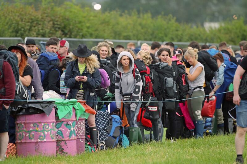 People arrive on the first day of the Glastonbury Festival