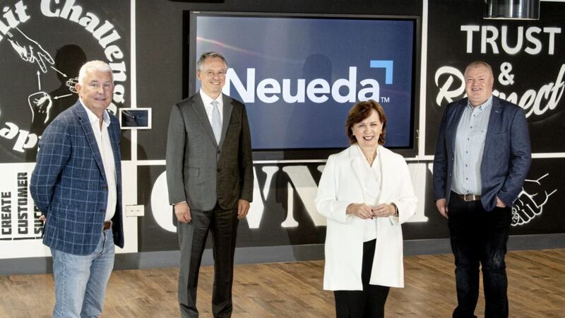Neueda&#39;s chief executive Brendan Monaghan (left) and chief operating officer Paddy O&rsquo;Hagan (right) with economy minister Diane Dodds and Invest NI chief executive Kevin Holland 