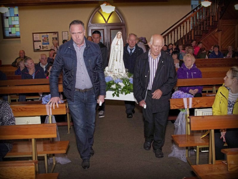 The Our Lady of Fatima statue being carried into St John the Baptist Chapel in Galbally. Picture by Jim Hamill 