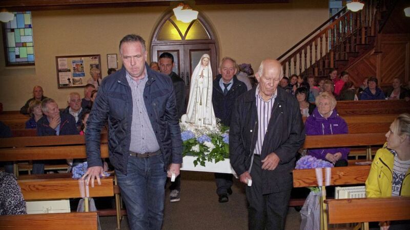 The Our Lady of Fatima statue being carried into St John the Baptist Chapel in Galbally. Picture by Jim Hamill 