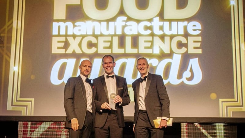 Colin Stanley (centre) of Willowbrook Foods collects the award from Jon Poole (right), chief executive of the Institute of Food Science &amp; Technology and English Rugby World Cup winner Matt Dawson (left). 