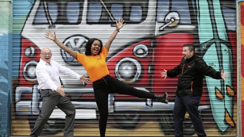 Esther Mayberry jumps for joy at the news that a brand new lifestyle store has opened in Belfast. Included are Andrew Penney (managing director), Joe McIlvenny (general manager) and Conor Magvock (sales). Picture: Darren Kidd/Press Eye 