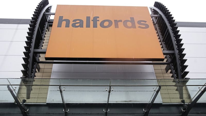 Halfords has seen strong demand for motoring maintenance and servicing boost sales, but said retail trading was held back by unsettled summer weather and falling consumer confidence 