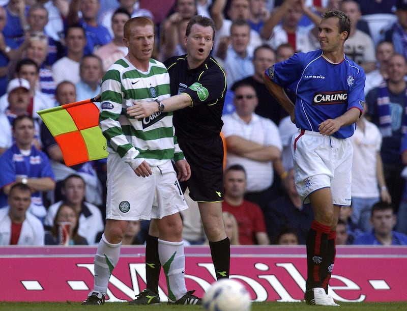 Celtic's Neil Lennon (left) and Rangers Thomas Buffel during a fiery Bank of Scotland Premier League match at Ibrox Stadium Glasgow on Saturday August 20 2005