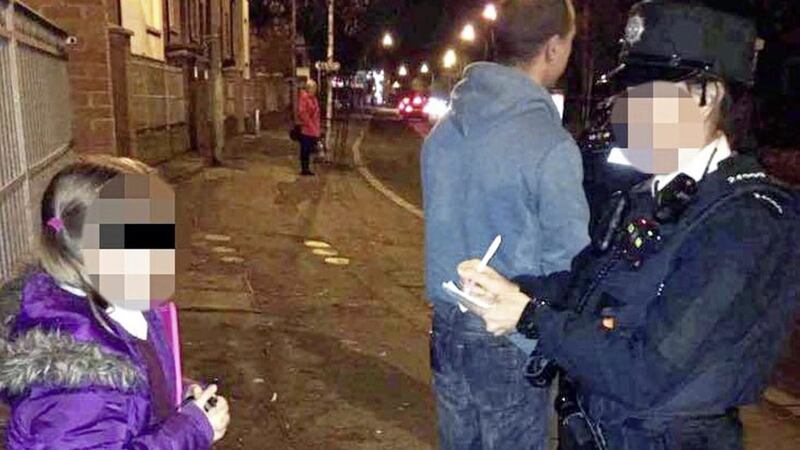 The 10-year-old girl pictured with a PSNI officer in west Belfast 