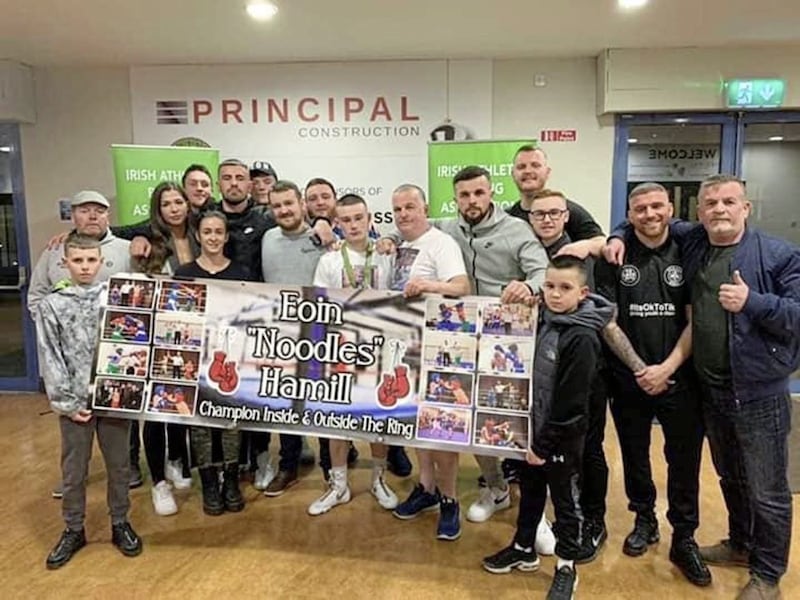 Gleann bantamweight Marty McCullough and supporters with a banner in memory of the late Eoin Hamill following his Irish U18 title success in Dublin last Friday night 