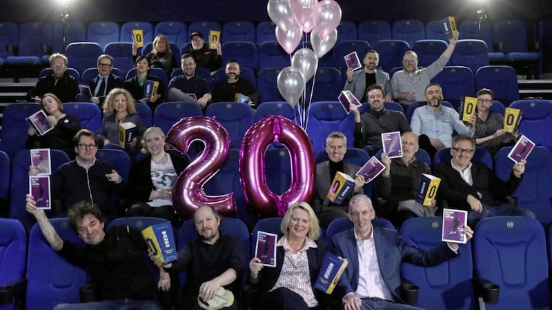 Festival director Michele Devlin, front row, and film-makers celebrate the 20th anniversary of Belfast Film Festival 