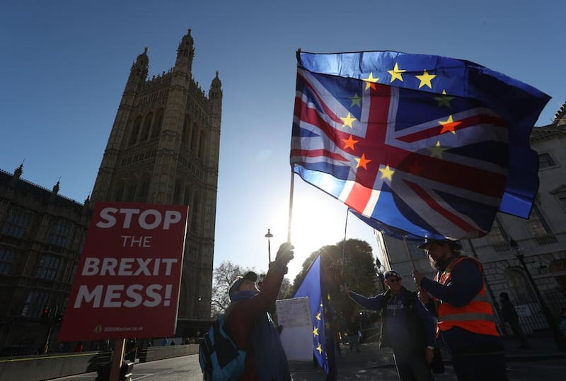 Anti-Brexit campaigners outside the Houses of Parliament in London