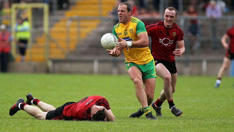 Donegal&rsquo;s Michael Murphy on the attack with Down&rsquo;s Shay Millar in pursuit during yesterday&rsquo;s Ulster SFC semi-final in Clones&nbsp;