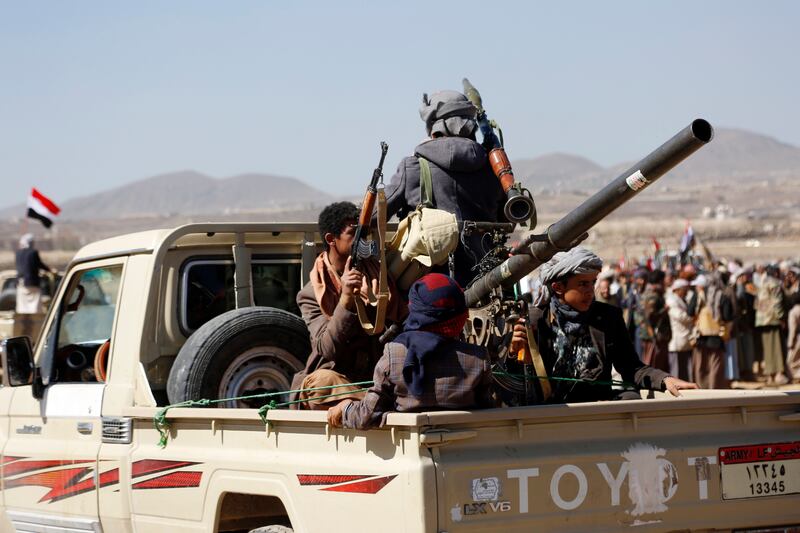 Houthi fighters and tribesmen stage a rally against the US and the UK strikes on Houthi-run military sites near Sanaa, Yemen (AP)