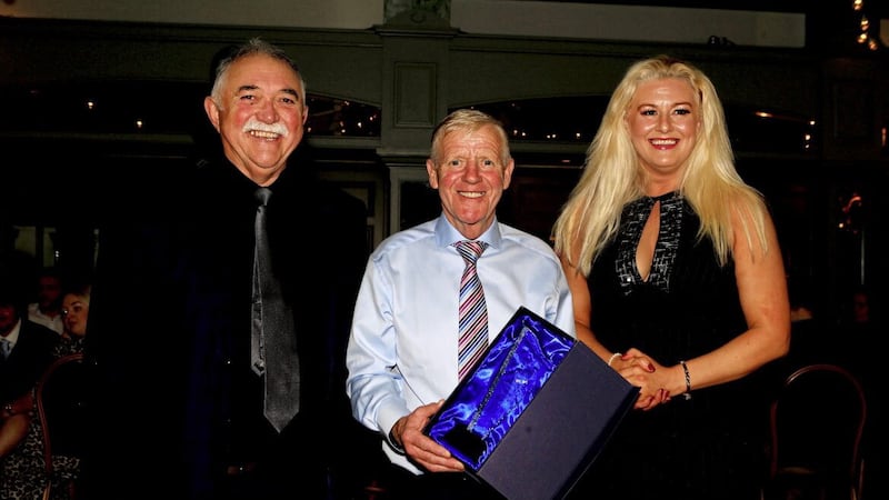 Holy Trinity coach Michael Hawkins was presented with a lifetime achievement award from new IABA president Gerry O'Mahony and secretary Antoinette Faye-McClean at the club's 50th anniversary gala evening in Belfast's Balmoral Hotel on Saturday night. Picture: Seamus Loughran 