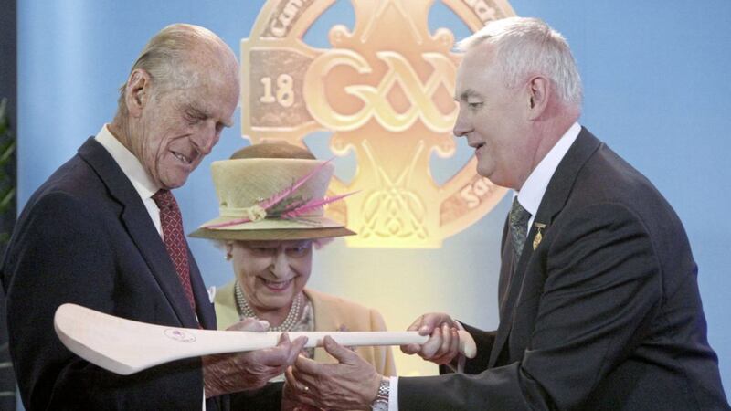 Queen Elizabeth and the Duke of Edinburgh admire a hurley passed to them by GAA President Christy Cooney during a tour of Croke Park, Dublin, in May 2011. Photo: Maxwells/PA Wire. 