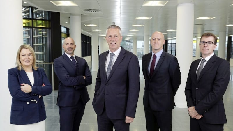 John Hansen (centre), partner in charge at KPMG in Northern Ireland, with the firm&#39;s four new partners (from left) Ashleen Feeney, Dominic Mudge, Paddy Doherty and Neil O&rsquo;Hare 