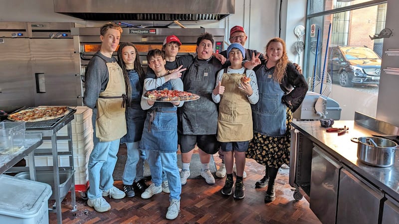 Harry Trevelyan, Nico Parker, Gabriel Howell, Mason Thames, Julian Dennison and Julian's nephew Bronwyn James with staff from Flout! pizza.