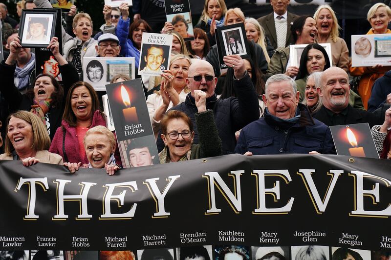 Survivors, family members and supporters in the garden of remembrance in Dublin after a verdict of unlawful killing was returned by the jury in the Stardust fire inquests