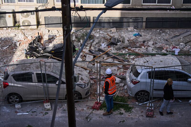 Israeli authorities inspect the site of a direct hit from an Iranian missile in Ramat Gan, Israel (Oded Balilty/AP)
