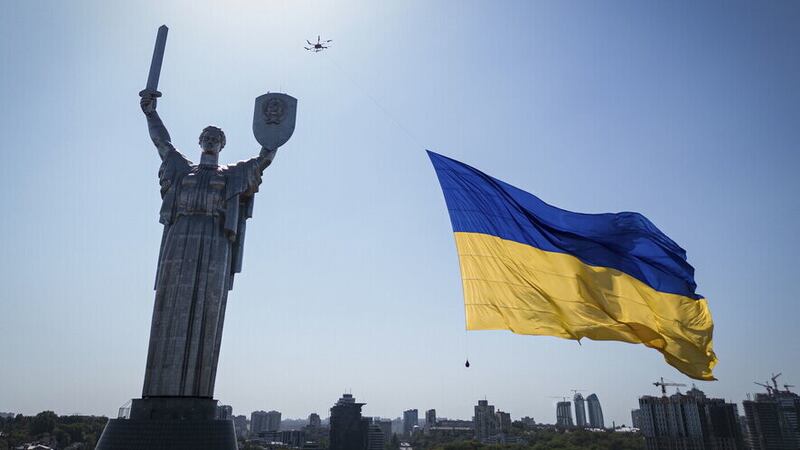 A drone carrying a flag in Ukrainian capital Kyiv last August. Picture: AP Photo/Evgeniy Maloletka