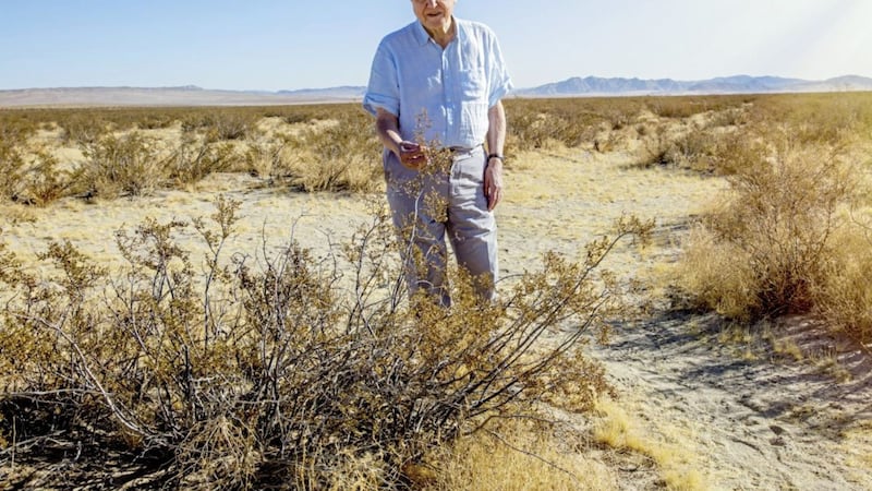 Sir David Attenborough standing within a Creosote Bush in the Mojave Desert which he previously visited 40 years ago. The bush had grown an inch since he last saw it 