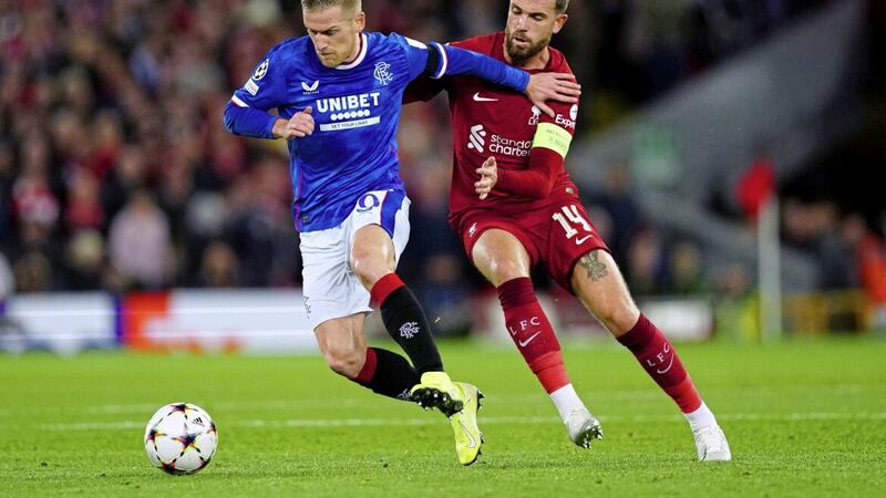 Rangers&#39; Steven Davis (left) and Liverpool captain Jordan Henderson battle for the ball during the Champions League, Group A match at Anfield. 