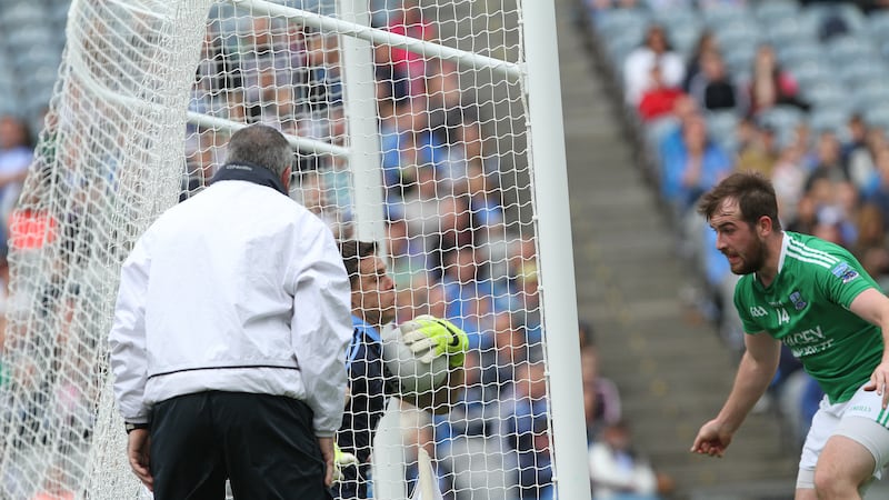 Dublin 'keeper Stephen Cluxton falls over the goal-line as Fermanagh's Se&aacute;n Quigley looks on <br />Picture: Colm O'Reilly &nbsp;