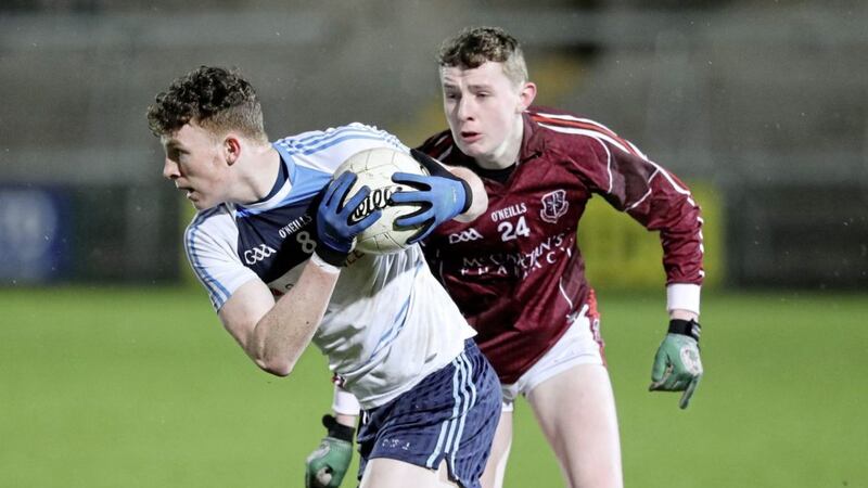 St Mary's, Magherafelt's Kealan McCann steals a march with St Paul's, Bessbrook's Connor O'Neill in hot pursuit during last night's MacRory Cup semi-final replay <br />Picture by Declan Roughan