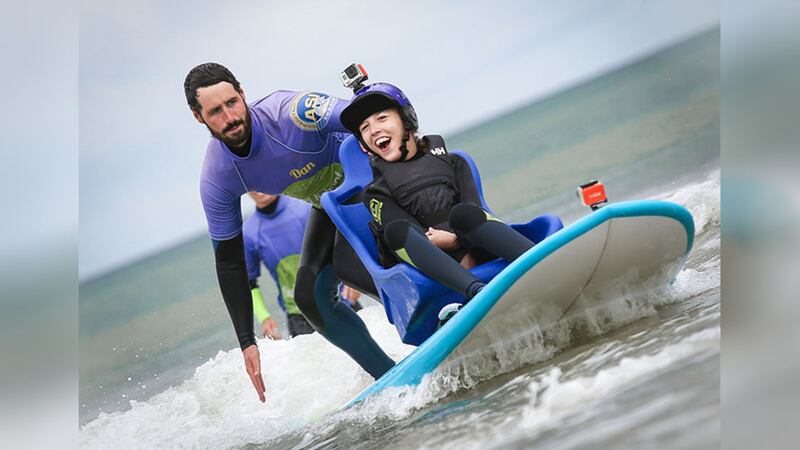 Talia McDowell (18) tries out a surfboard suitable for wheelchair users at Benone beach<br />&nbsp;