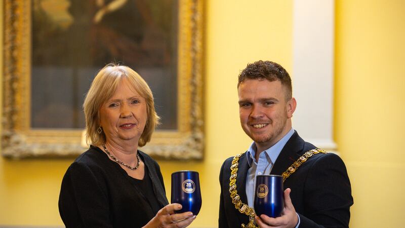 Belfast Healthy Cities Chief Executive Joan Devlin was congratulated by Lord Mayor Ryan Murphy as she prepares to retire after 30 years.