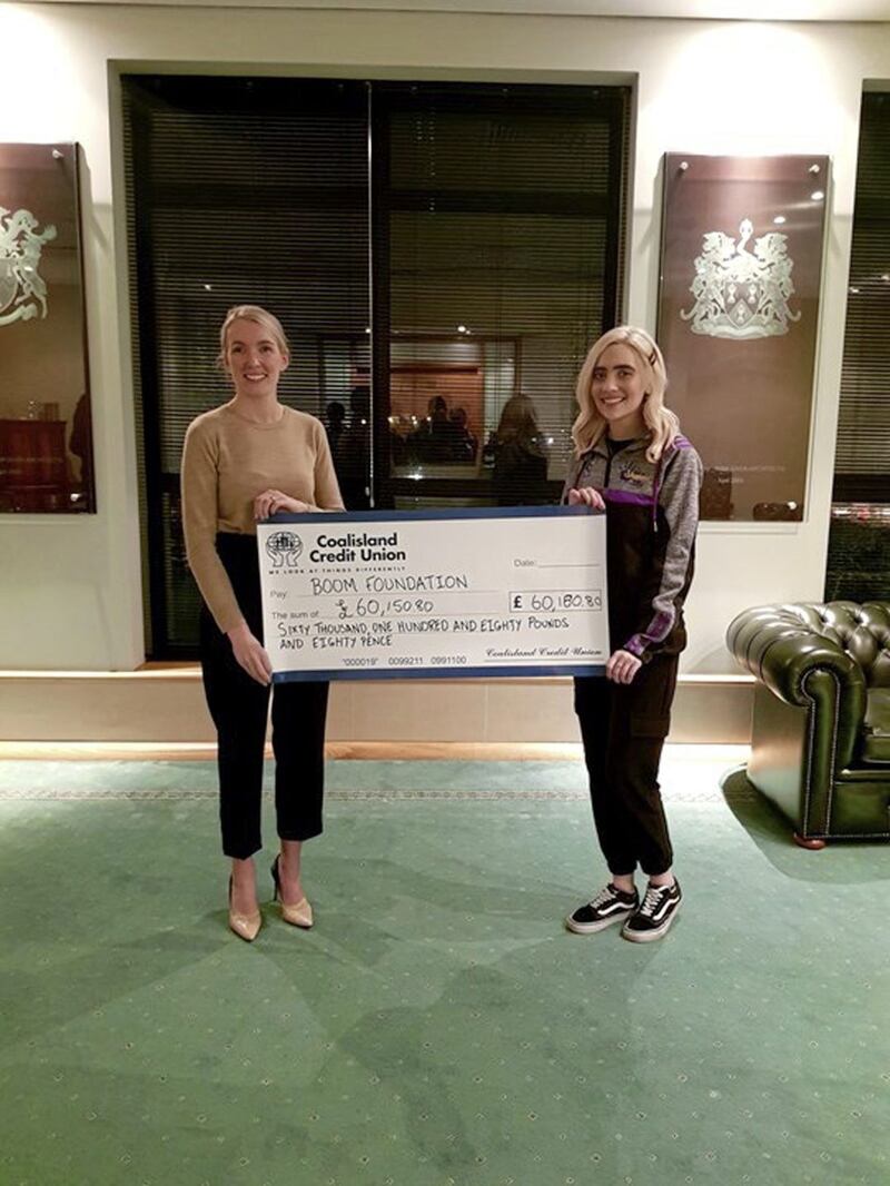 Shannon Whitehouse presents a cheque for more than &pound;60,000 to Leona Rankin from the Boom Foundation 