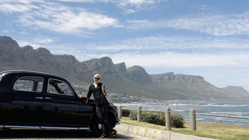 Katie Wright who explored the food and drink culture of Cape Town, South Africa, in front of the 12 Apostles mountain range 