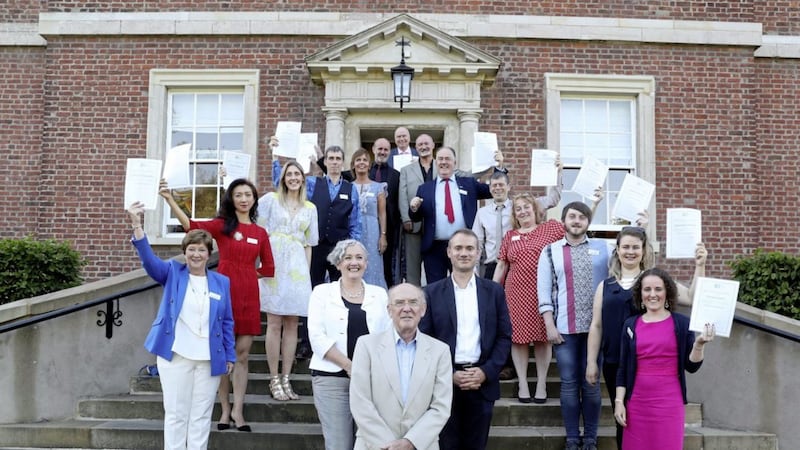 A total of 15 White Badge accredited tour guides graduated at Clifton House for the Belfast Charitable Society, giving tourism a boost in Belfast. Pictured are 14 of the graduates with Sir Ronald Weatherup, President of the Belfast Charitable Society, (centre front) to his left, &Uacute;na Duffy, National Lottery Heritage Fund, and (right) Kevin Guinchard of the Institute of Tourism Guiding(ITG). Clifton House tours run daily Monday to Friday in July and August at 3pm, less the 12 and 15 July 