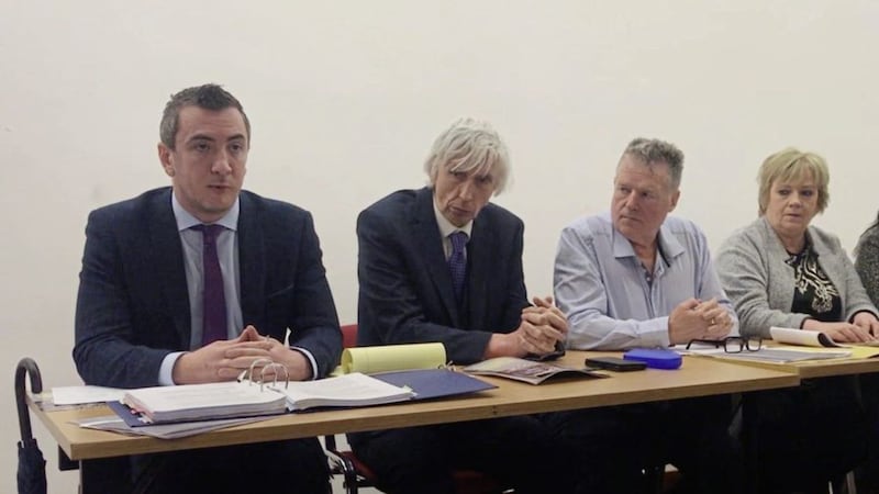 Solicitor Gavin Booth (left), sitting with the family of Seamus Ludlow.  