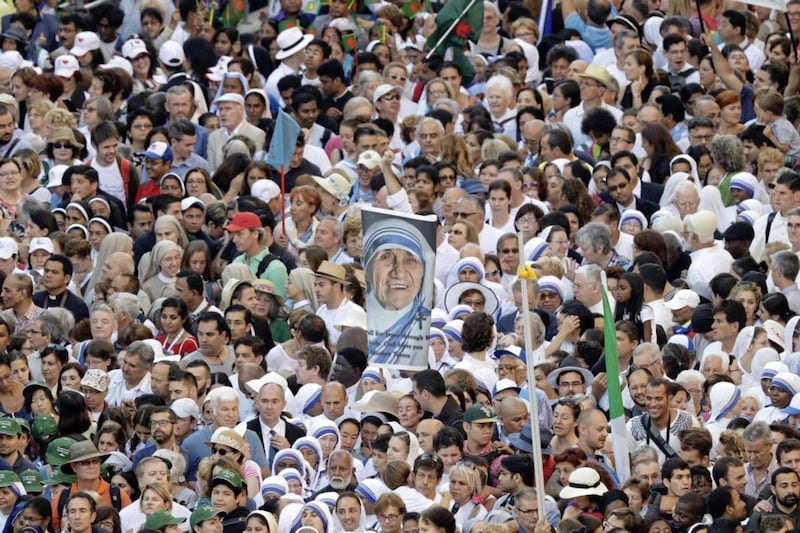 Faithful and pilgrims wait to enter in St Peter's Square at the Vatican before a canonization ceremony on Sunday September 4 2016