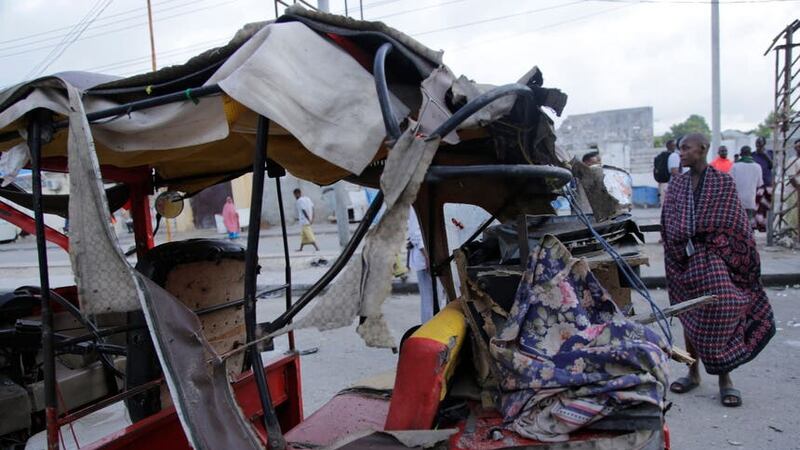 A destroyed tuktuk outside the Pearl Beach hotel in Mogadishu (AP)