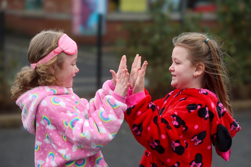 School children from St Kevin's Primary School in west Belfast take part in a sponsored PJ day to raise money for charity, pupil Meabh Smith lost her mum last year to ovarian cancer. All the children and staff dressed up in onesies, oddies and various other colourful pyjamas PICTURE MAL MCCANN