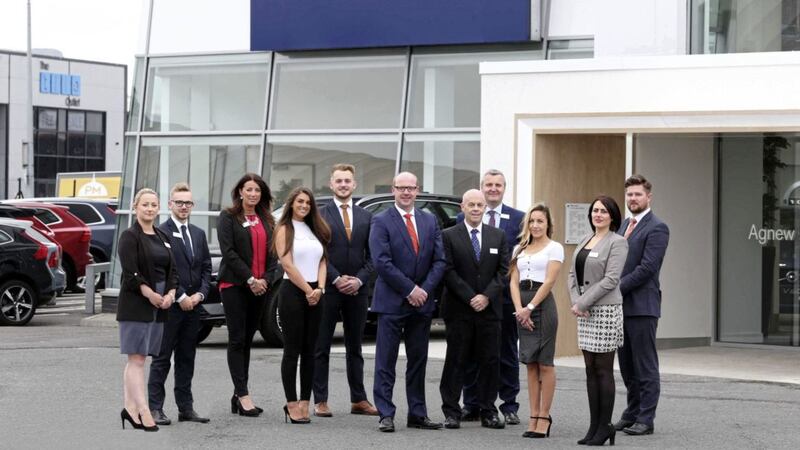 Agnew Belfast Volvo managing director, Sydney Pentland (centre) and the sales team at the new showroom 