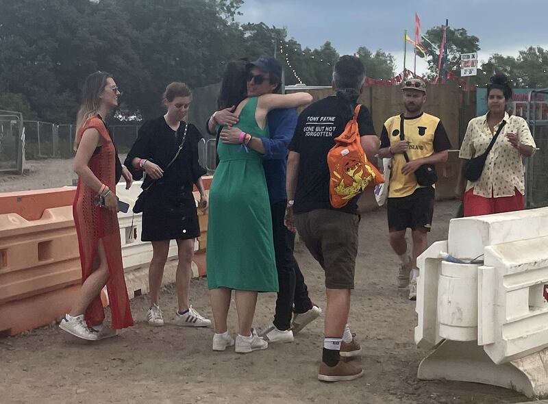 Princess Beatrice (2nd left) with husband Edo Mapelli Mozzi (centre) greets friends with a hug near the hospitality interstage area of the Glastonbury Festival