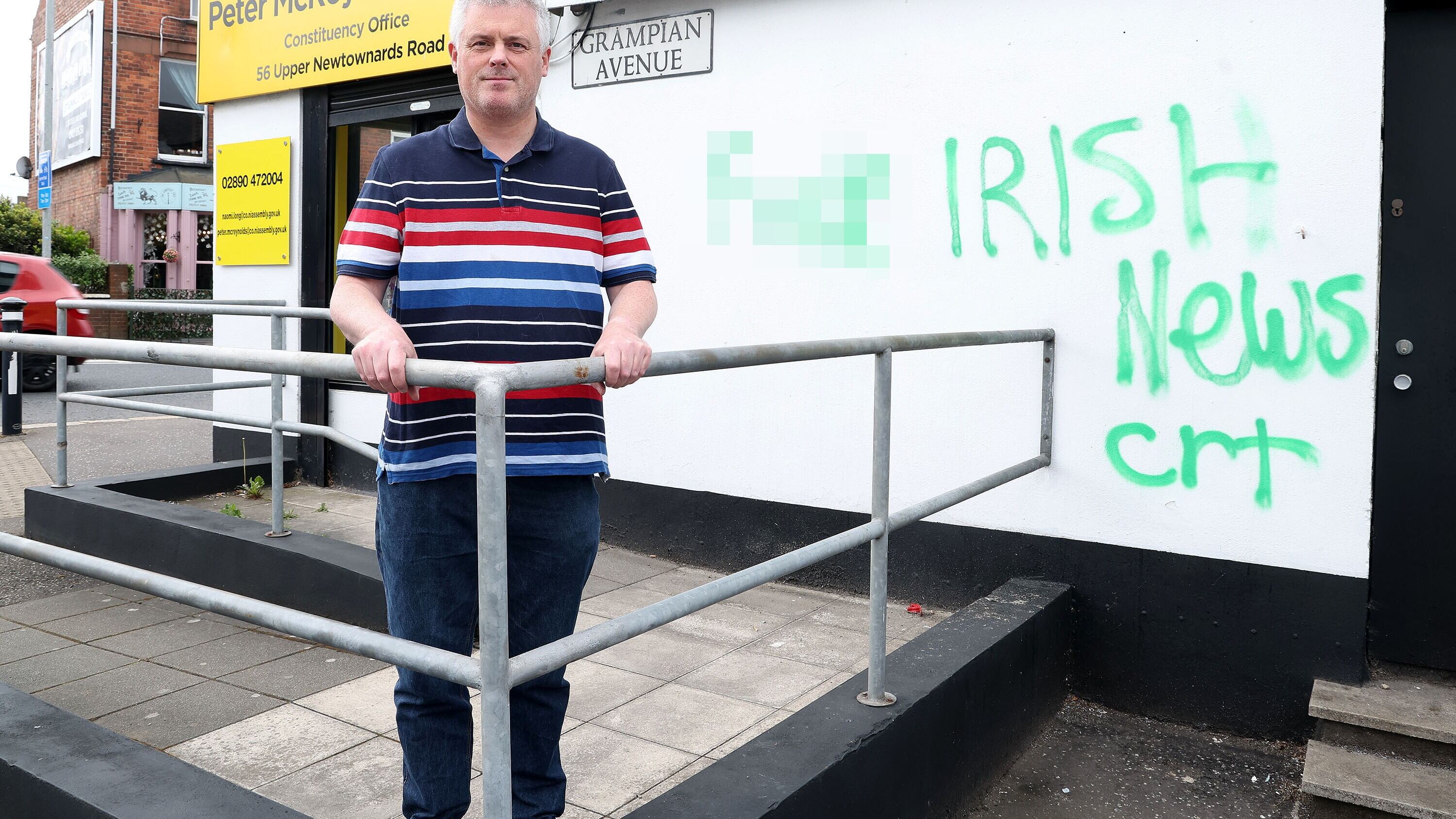 Alliance councillor Michael Long at the party's office on the Newtownards Road. PIcture Mal McCann