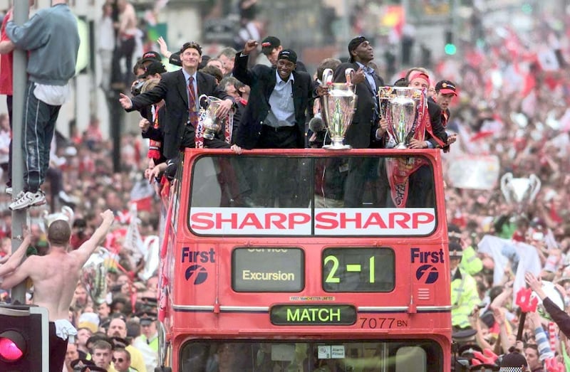 Manchester United celebrate their trophy treble in 1999 on an open-top bus parade