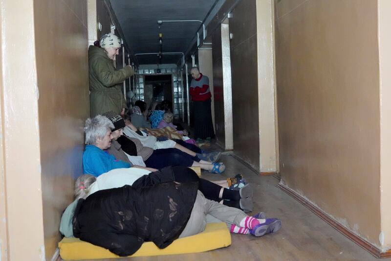 Patients take cover after a Russian attack on psychiatric hospital in Kharkiv, Ukraine (Andrii Marienko/AP)