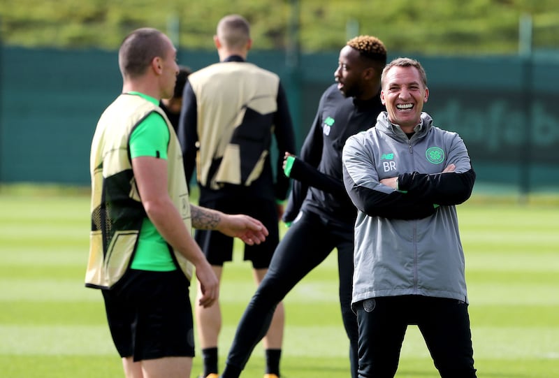 Celtic manager Brendan Rodgers shares a joke with Scott Brown