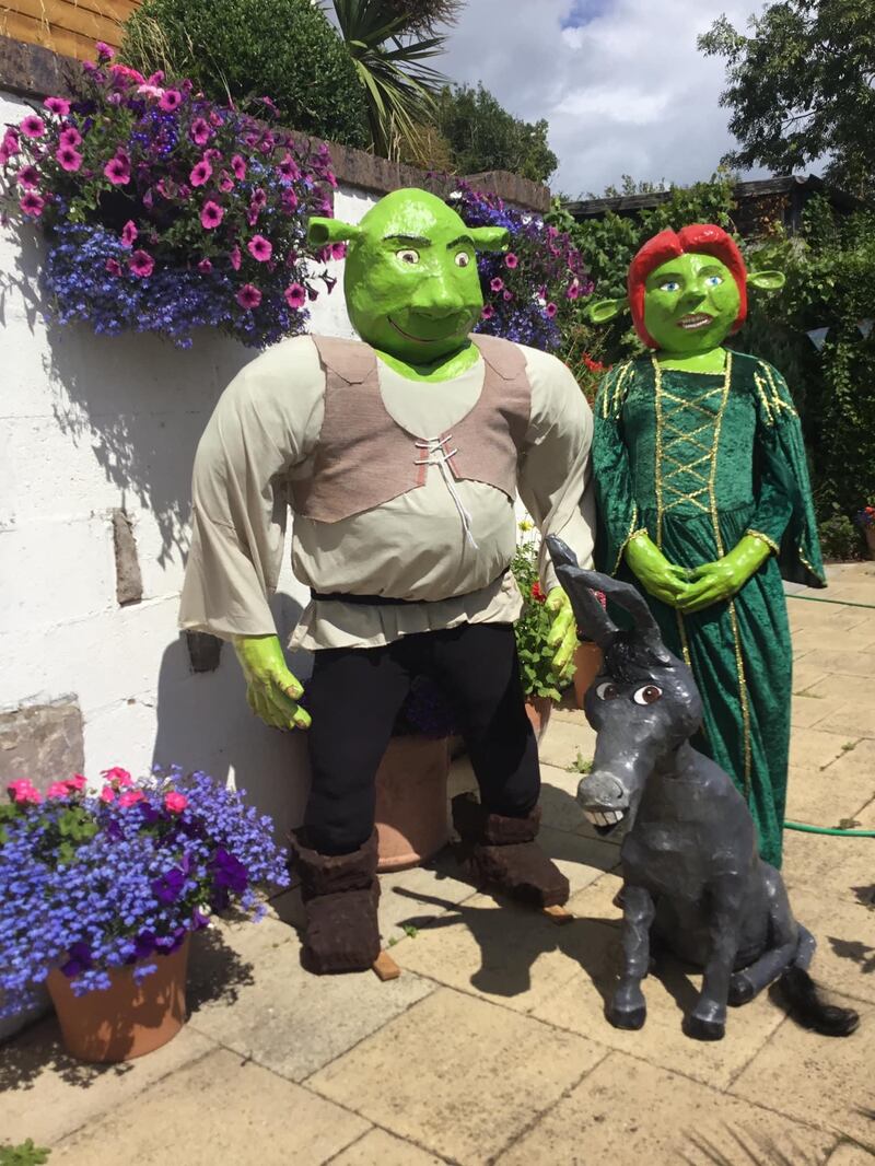 Scarecrow figures of Shrek, Fiona and Donkey for the festival