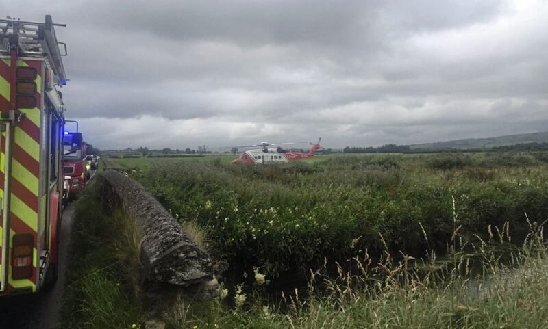 A woman, aged in her 60s, was taken to Altnagelvin Area Hospital in Derry by the coastguard helicopter after the dramatic rescue. Picture by NIFRS/ Facebook 