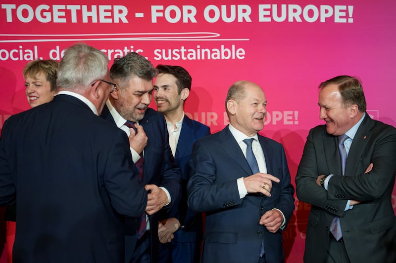 Romania’s Prime Minister Marcel Ciolacu, third left, with German Chancellor Olaf Scholz, second right, and PES president Stefan Lofven, right, ahead of the Party of European Socialists conference in Bucharest (Andreea Alexandru/AP)