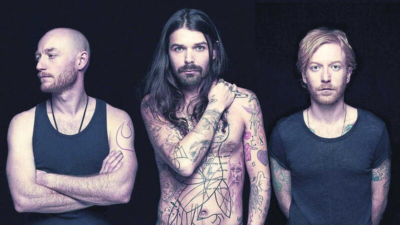 &#39;Frequently topless&#39; frontman Simon Neil (centre) will lead Biffy Clyro into battle at Belsonic tomorrow night 